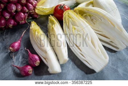 Fresh Belgian Endive Or Chicory Bitter Salad Ready To Cook Or Eat Close Up