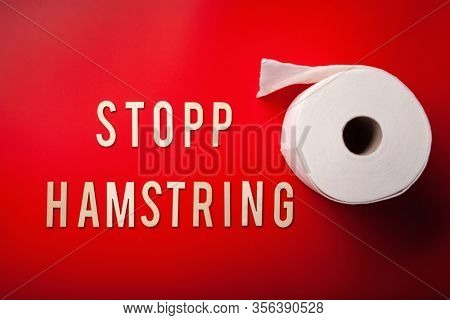 stopp hamstring norwegian word toilet paper text wooden letter on red background coronavirus covid-19