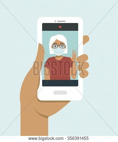 Human Hand Holding Smart Phone video Call On The Screen With Your Elderly Family Member, Mother, Gra