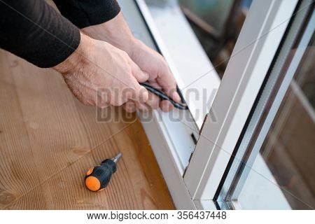 Professional Master At Repair And Installation Of Windows, Changes Rubber Seal Gasket In Pvc Windows