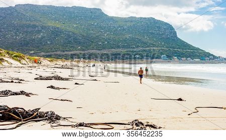 People Walking On Blue Flag Fish Hoek Beach At Low Tide