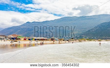 Kids Building Sand Castles On The Beach During School Holidays
