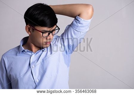 Close Up Asian Man With Hyperhidrosis Sweating. Young Asia Man With Sweat Stain On His Clothes Again