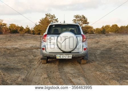 Dnipro, Ukraine - February 19, 2020: Toyota Rav4 2006 Gray Color Among The Sand Near The Forest, Ope