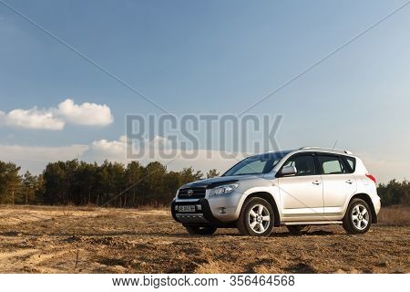 Dnipro, Ukraine - February 19, 2020: Toyota Rav4 2006 Gray Color Among The Sand Near The Forest, Ope