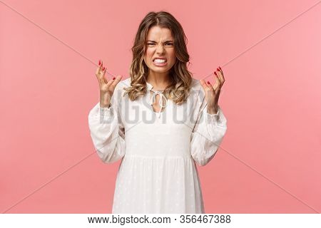 Portrait Of Woman Losing Control Over Emotions, Feel Pressured And Tensed, Lose Temper, Clench Hands