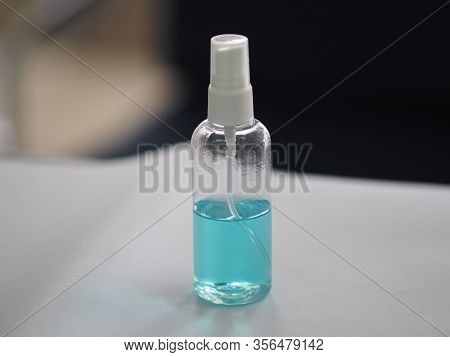 Alcoholic 70 Percent In Clear Plastic Bottle Spray, Hand Sanitizer On White Table Washing Clean Dirt