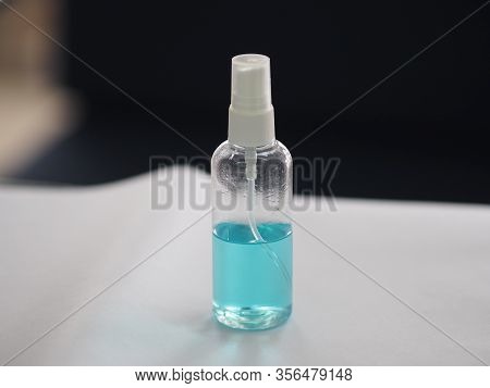 Alcoholic 70 Percent In Clear Plastic Bottle Spray, Hand Sanitizer On White Table Washing Clean Dirt