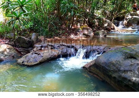 Small tropical waterfall somewhere in the jungle