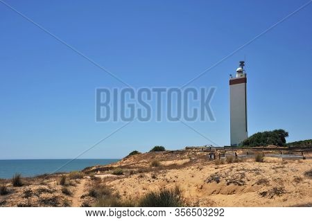 Matalascanas, Spain - July 10, 2011:lighthouse On The Atlantic Ocean In Matalascanas
