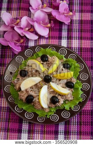 Ready Cold Dish: San Isidoro Salad With Tuna, Eggs And Vegetables On A Brown Plate - Spanish Cuisine
