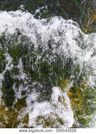 Beauty And Strength Of A Deep Blue Sea And Green Seaweed Underwater. Beautiful Seawaves Texture.