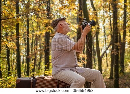 Shooting Autumn Session. Old Man Shoot In Nature. Landscape And Nature Photo Shooting. Using Handhel