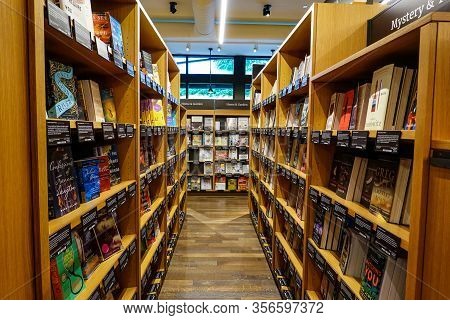 Seattle,wa/usa-9/15/19: An Aisle Of Wooden Book Shelves At The Original University District  Amazon 
