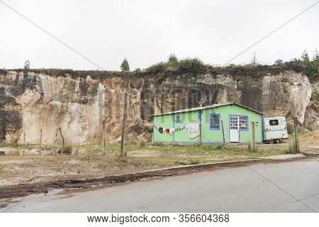 Aquitania, Boyaca / Colombia: April 7, 2018: Green Rural House On The Side Of The Road, Near Lake To