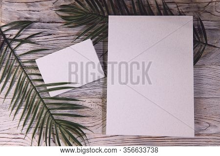 Mosk Up. Abstract Background. Two Cards Of Different Sizes On A Wooden Surface. Texture Of Paper And