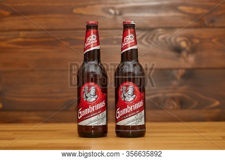 BUDAPEST, HUNGARY - DECEMBER 12, 2019: Two bottles of Gambrinus Czech beer on a counter, 150th anniversary edition