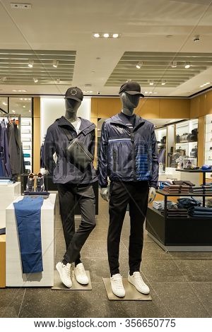 SINGAPORE - APRIL 21, 2019: clothes on display at Hugo Boss store in Singapore Changi Airport. Hugo Boss AG is a German luxury fashion house headquartered in Metzingen.