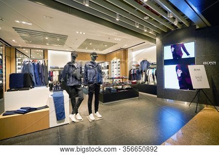 SINGAPORE - APRIL 21, 2019: clothes on display at Hugo Boss store in Singapore Changi Airport. Hugo Boss AG is a German luxury fashion house headquartered in Metzingen.