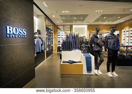 SINGAPORE - APRIL 21, 2019: clothes on display at Hugo Boss store in Singapore Changi Airport. Hugo Boss AG is a German luxury fashion house headquartered in Metzingen.