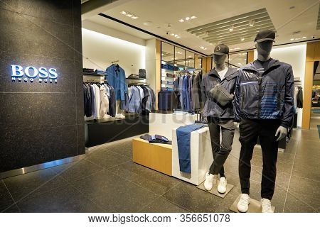 SINGAPORE - APRIL 21, 2019: clothes on display at Hugo Boss store in Singapore Changi Airport. Hugo Boss AG is a German luxury fashion house headquartered in Metzingen.