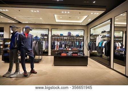 SINGAPORE - APRIL 21, 2019: clothes on display at Hugo Boss store in Singapore Changi Airport. Hugo Boss AG is a German luxury fashion house headquartered in Metzingen.