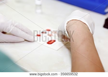 Scientist Working In His Laboratory. A Blood Test Is A Laboratory Analysis Performed On A Blood Samp