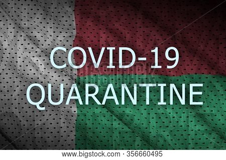 Madagascar Flag And Covid-19 Quarantine Inscription. Coronavirus Or 2019-ncov Virus