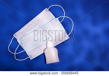 P Revention Of C Oronavirus. Medical Masks, Vitamins, Antiseptic On A Blue Background.