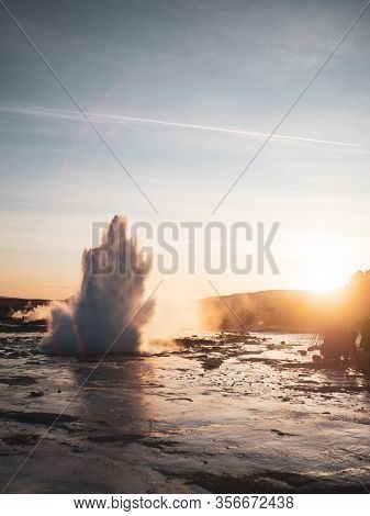 Famous Geysir In Iceland In Beautiful Sunset Light. One Of The Most Famous Natural Heritage On Icela