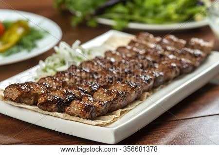 Fast Food. Eastern Food. Shish Kebab, Lyulya-kebab. Dishes Of Oriental Cuisine Lying In Plte And Dec