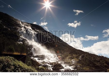 Waterfall Langfossand Power Station. National Tourist Route. Famous Landmark In Norway At Summer Tim
