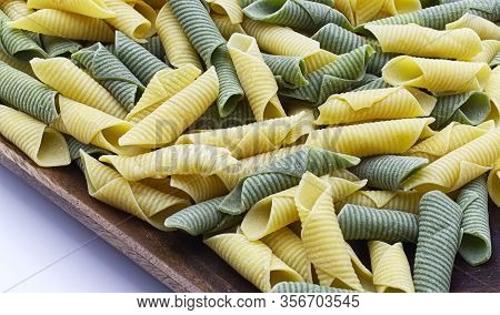 Italian Raw Colored Pasta. Maccheroni Al Pettine.