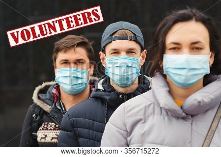 Group Of Young Volunteers. Coronavirus Epidemic. Global Pandemic. People Wears Face Mask. Coronaviru