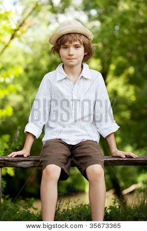 Teenager In A Hat And Shirt