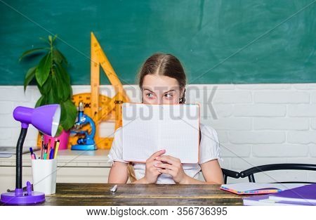 Hometask Concept. Hooked On Learning. Girl Cute Child Sit School Classroom Chalkboard Background. Sm