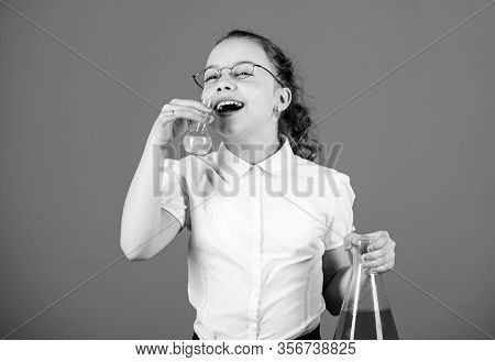 Science Research In Lab. Small School Girl. Small Smart Girl With Testing Flask. Child Study Bilogy 