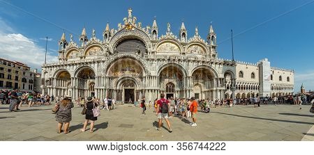 St. Mark Square, Venice, Italy - August 02, 2019: Torre Dell Orologio, Basilica And Museum San Marco