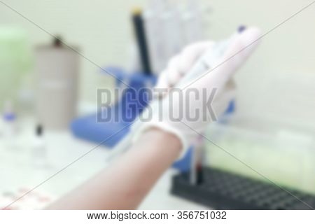 Scientist Working In His Laboratory. A Blood Test Is A Laboratory Analysis Performed On A Blood Samp