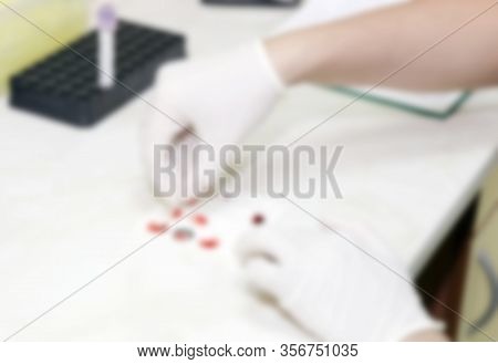 Scientist Working In His Laboratory. A Blood Test Is A Laboratory Analysis Performed On A Blood Samp