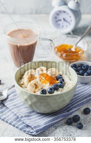 Breakfast With Milk Rice Porridge With Banans, Blueberry And Orange Jam, Creamy Rice Pudding Or Fren