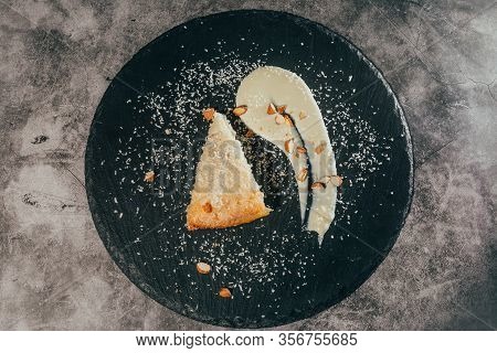 Cake With Almonds And Coconut Shvings On Top