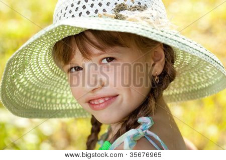 Dark-haired Girl In A Hat