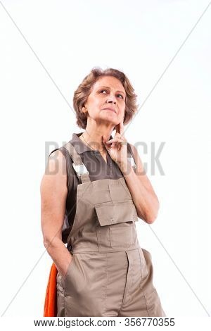 Happy senior woman with construction clothes (isolated on white)