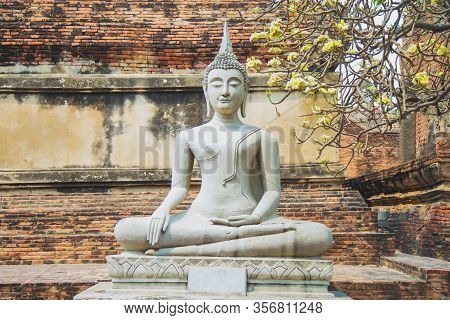 An Old Stucco Buddha Statue In The Ayutthaya Period Enshrined At The Wat Yaichaimongkol With Ancient