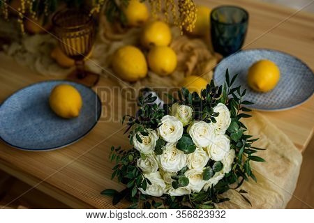 Wedding Bouquet Of White Roses On The Table