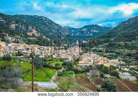 The Village Of Valldemossa With The Parish Church Of Sant Bartomeu, Mallorca, Spain