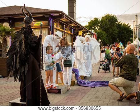 Kabardinka, Russia - August 8, 2019: People In Costumes Of Fairy-tale Characters On The Embankment O