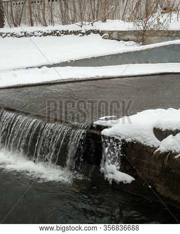 Urban Streams In Winter. The Lybid River (kyiv, Ukraine) In The Snow.