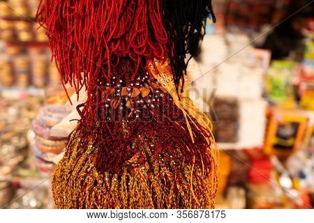 Different Gods Lockets In Local Shop At Tirumala Different Color Threads Of Gods In A Shop